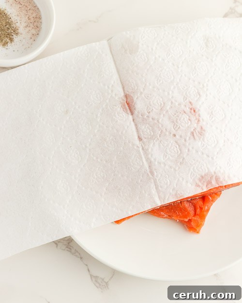 Rinsing and drying the salmon fillets.