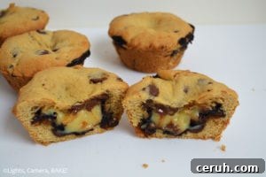 A spoonful of hot fudge and a drizzle of caramel being added to a cookie cup.