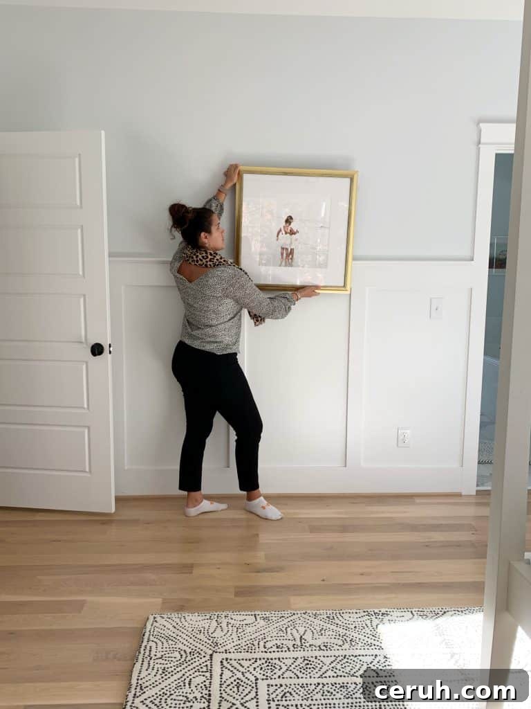 Kristin from 1st 28 photgraphy holding up a framed print