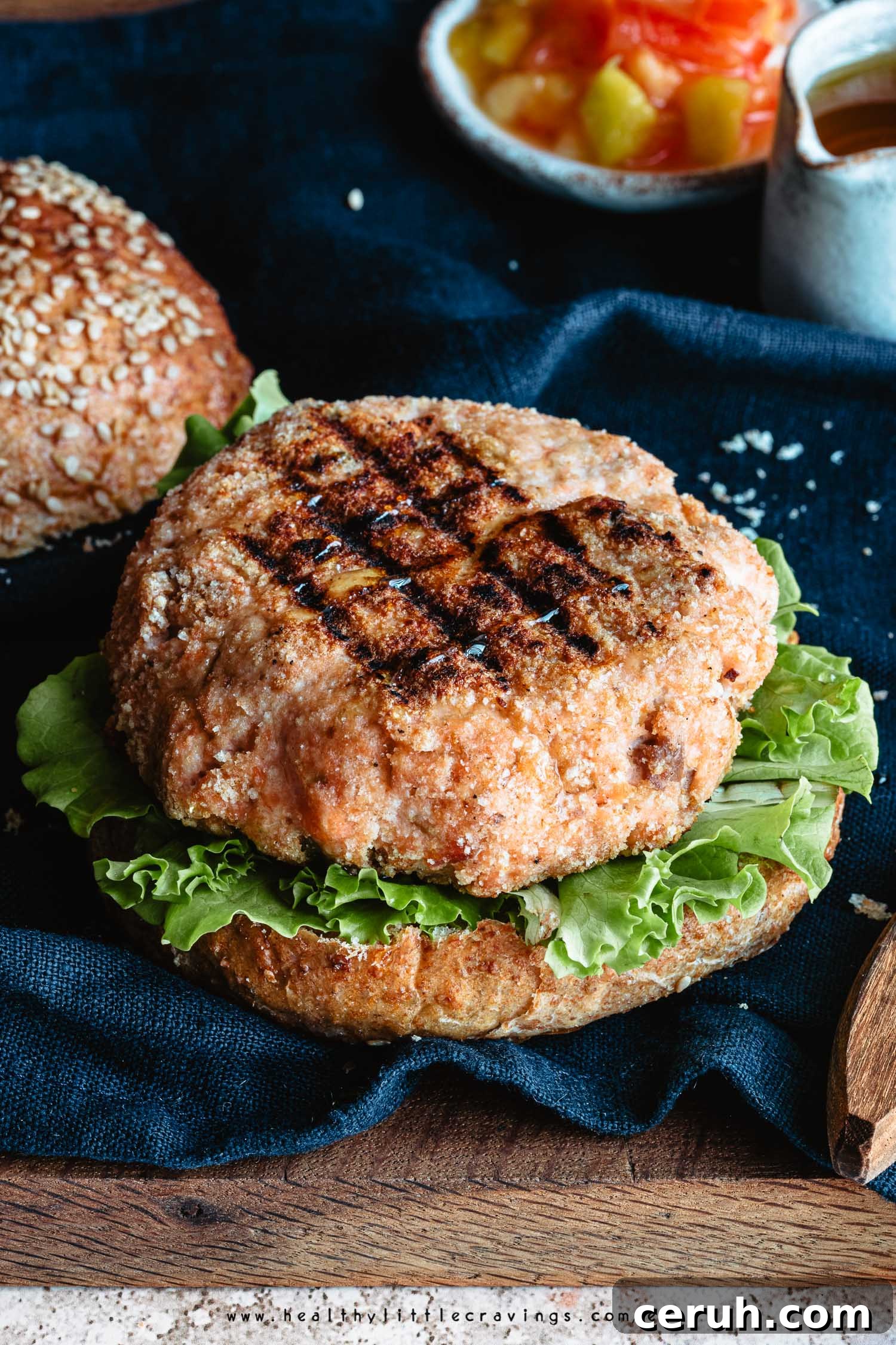 Grilled salmon burger on a whole wheat bun