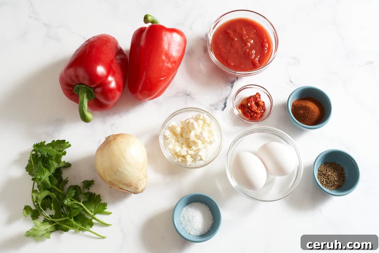 Two red bell peppers, an onion, fresh cilantro, and small bowls of eggs, feta cheese, harissa, smoked paprika, cumin seeds, and kosher salt.